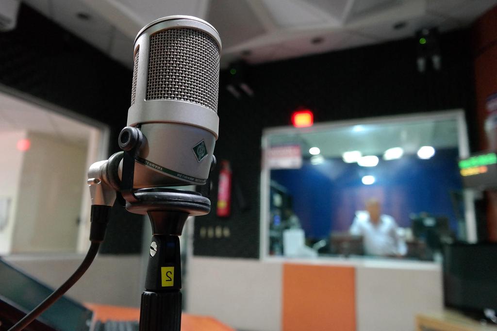 Podcast microphone and sound waves icon